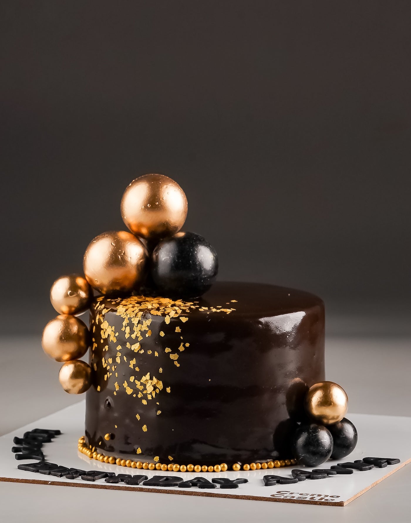Black and Gold Anniversary Cake