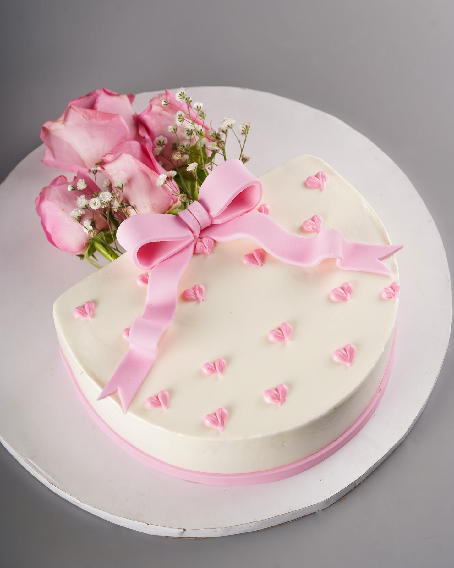 Bow-Kissed Cake Bouquet - Heart-shaped white cake with pink bow and fresh roses