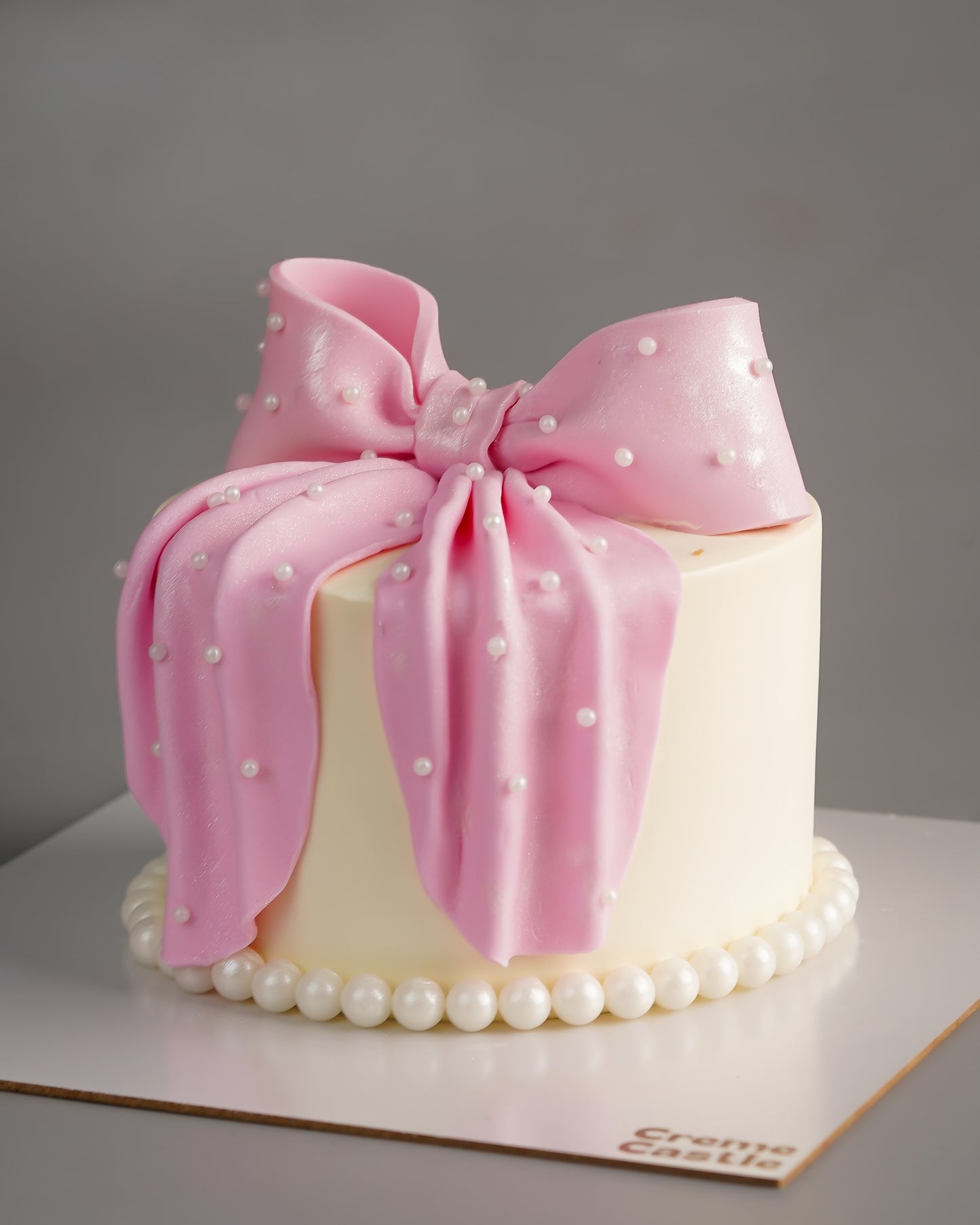 Pink Bow Pearl Drape Cake