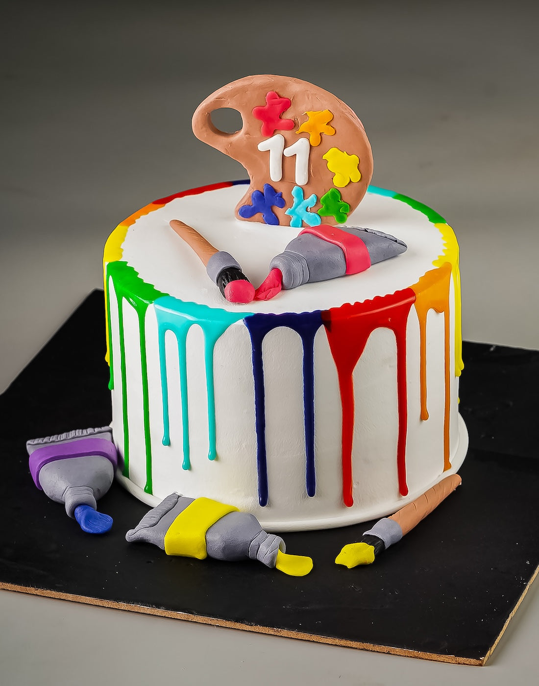 Painting Drip Cake by Creme Castle