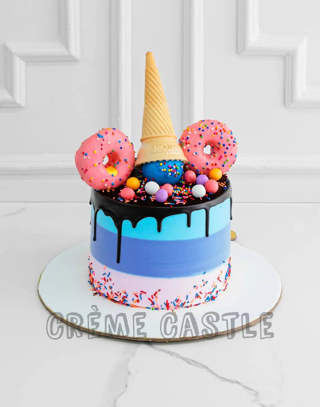 Inverted Cone and Rainbow Cake - Creme Castle