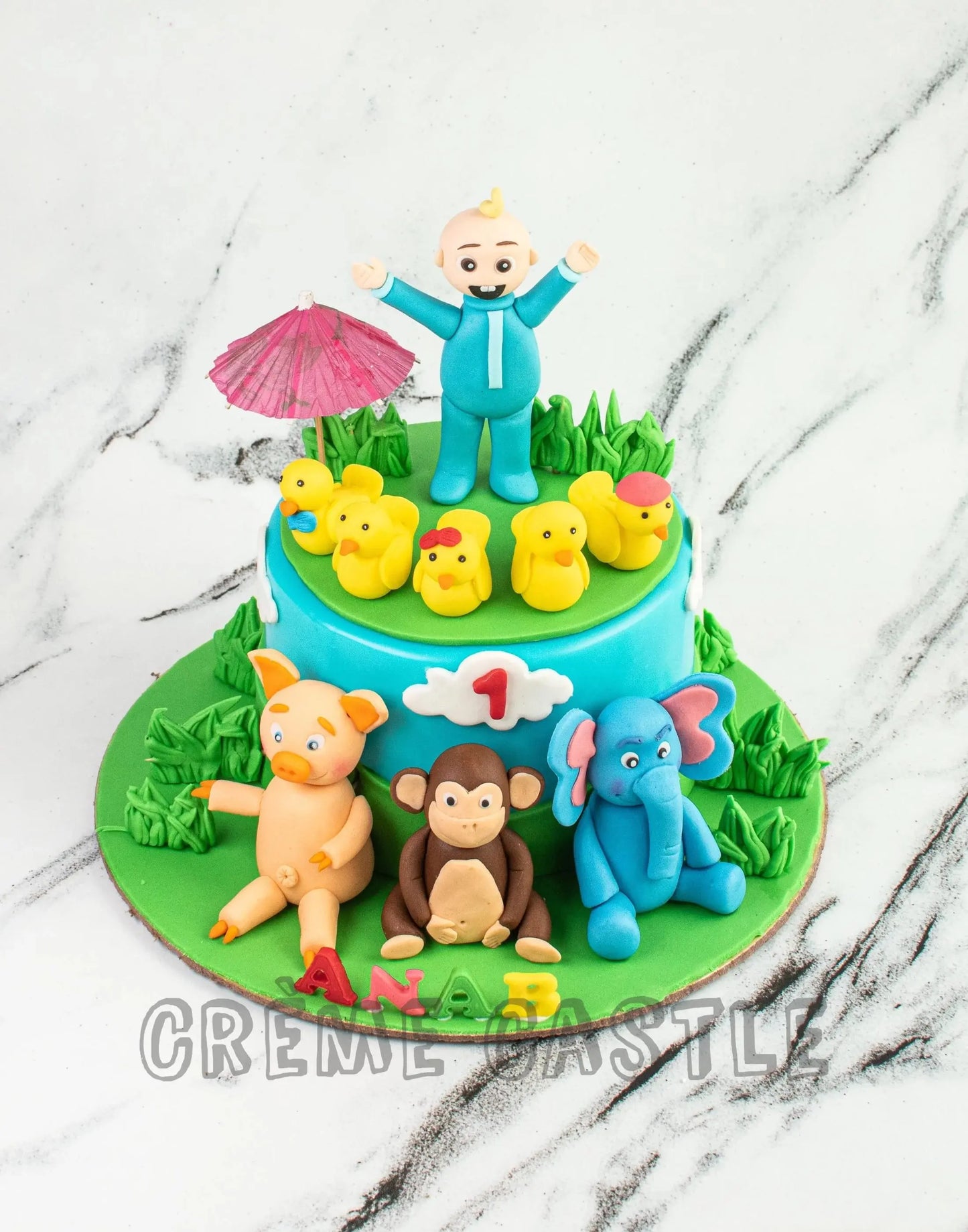 Cocomelon Theme cake with Joe by Creme Castle