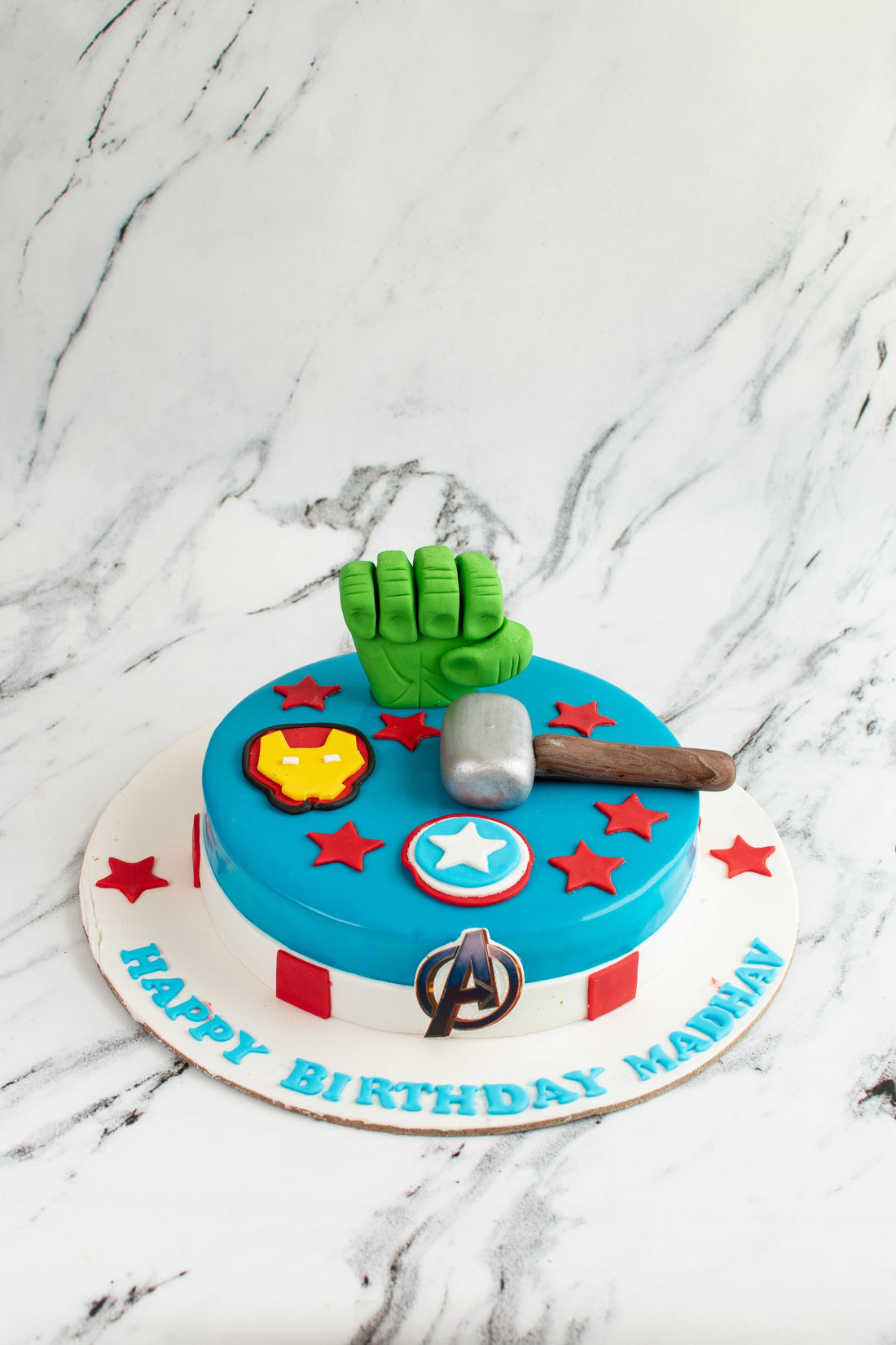 Avengers theme cake in blue color by Creme Castle