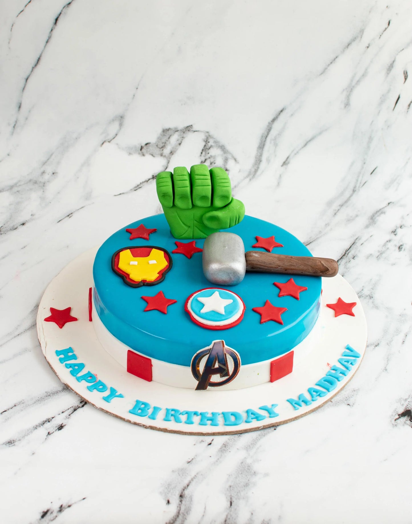 Avengers theme cake in blue color by Creme Castle