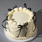 White Vintage Ribbon Cake