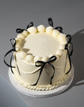 White Vintage Ribbon Cake