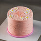 Pink cake with white flowers