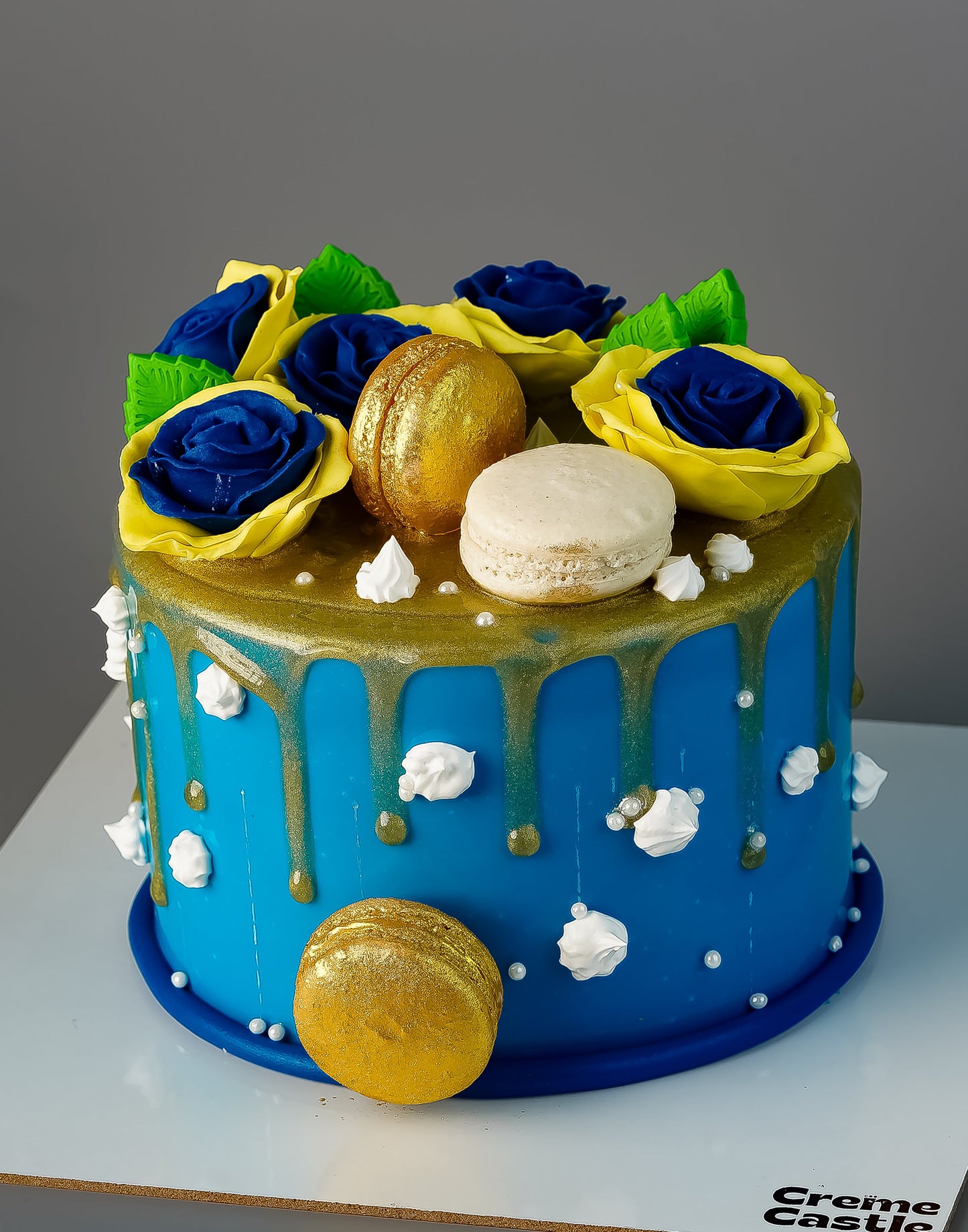 Golden Macaron Drip Floral Cake