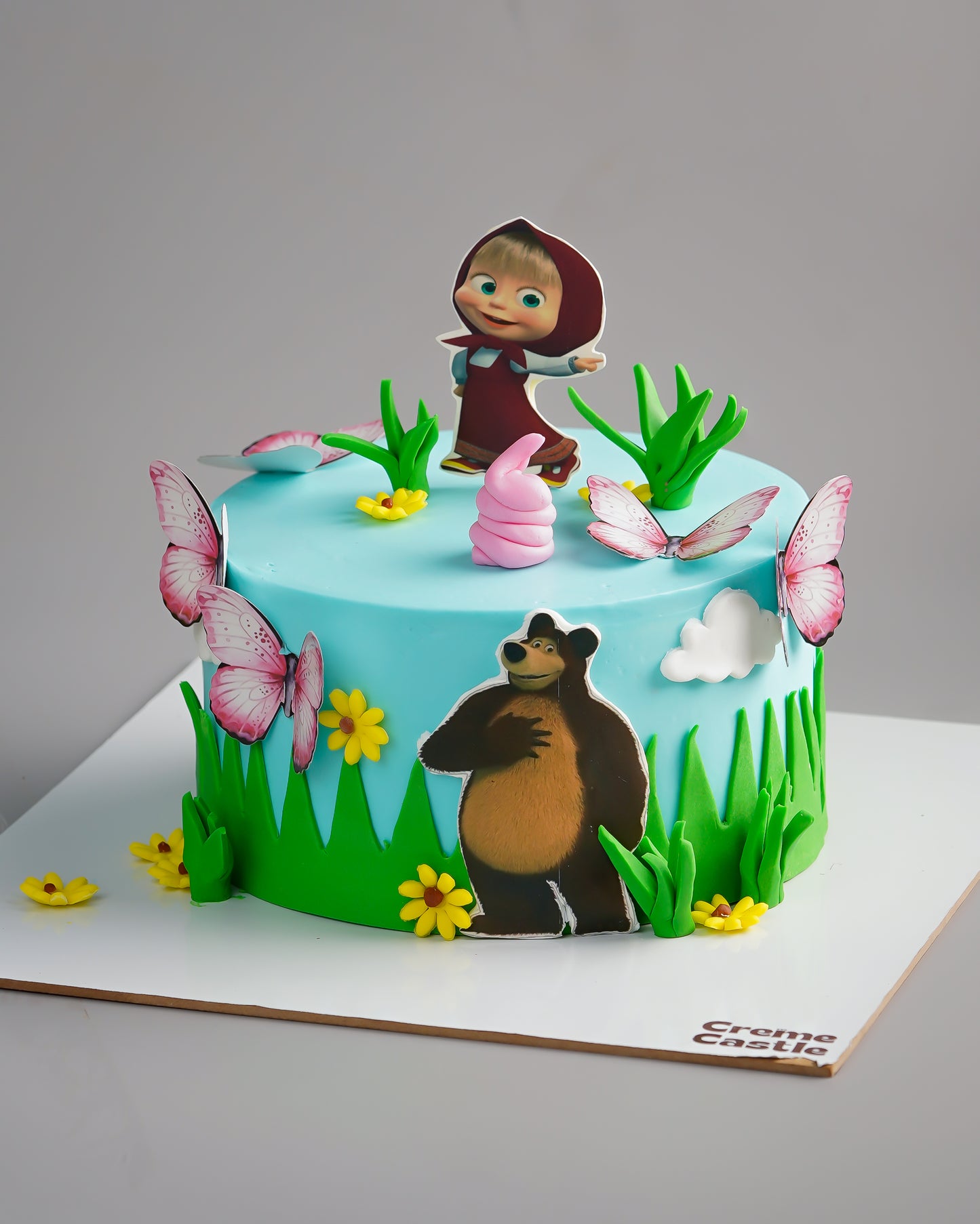 Masha Bear theme Cake in Blue by Creme Castle