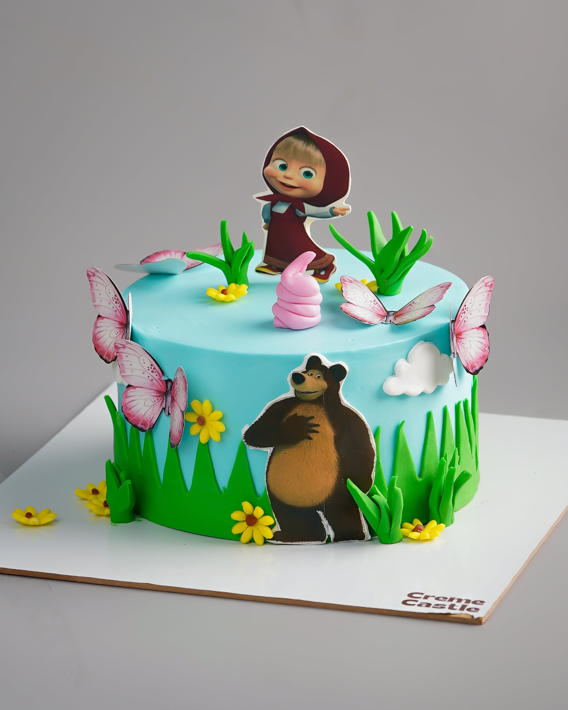 Masha Bear theme Cake in Blue by Creme Castle