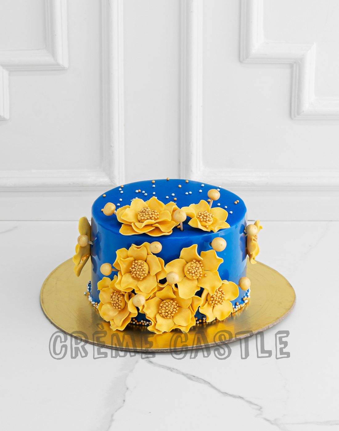 Royal blue and gold cake