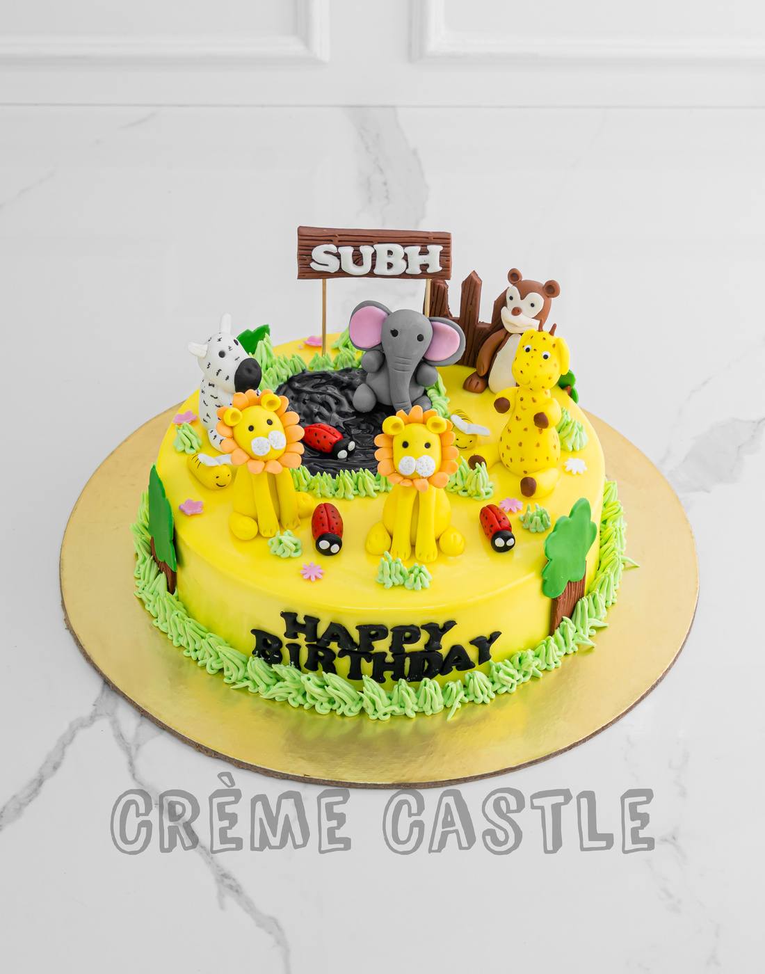 Jungle theme cake in Yellow by Creme Castle