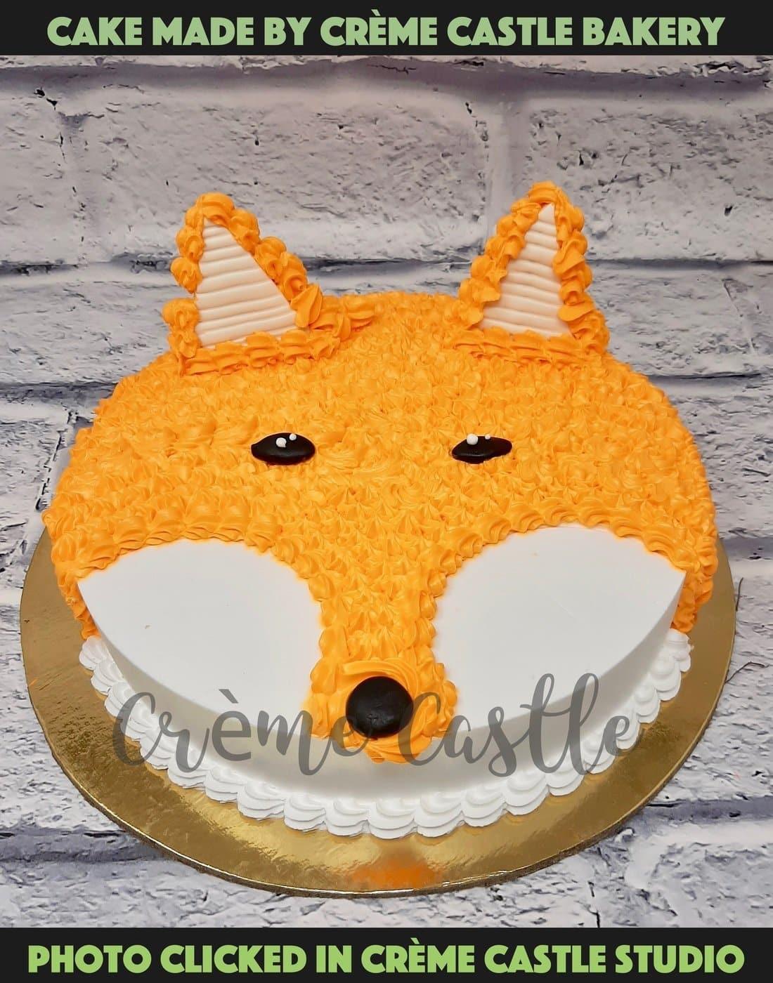 Orange colour dog cake - Creme Castle