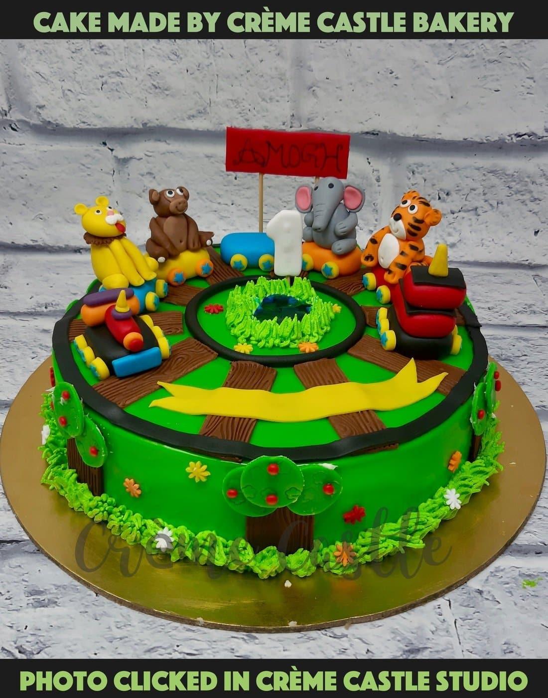 Animals on a train cake - Creme Castle