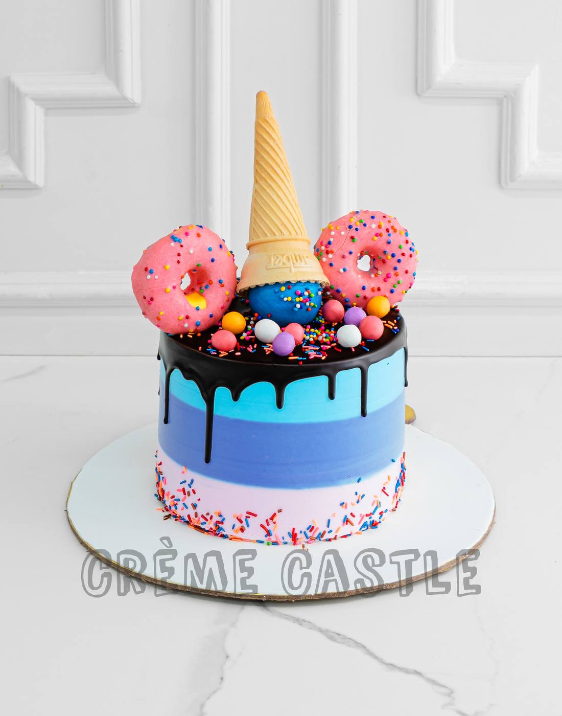 Inverted Cone and Rainbow Cake - Creme Castle