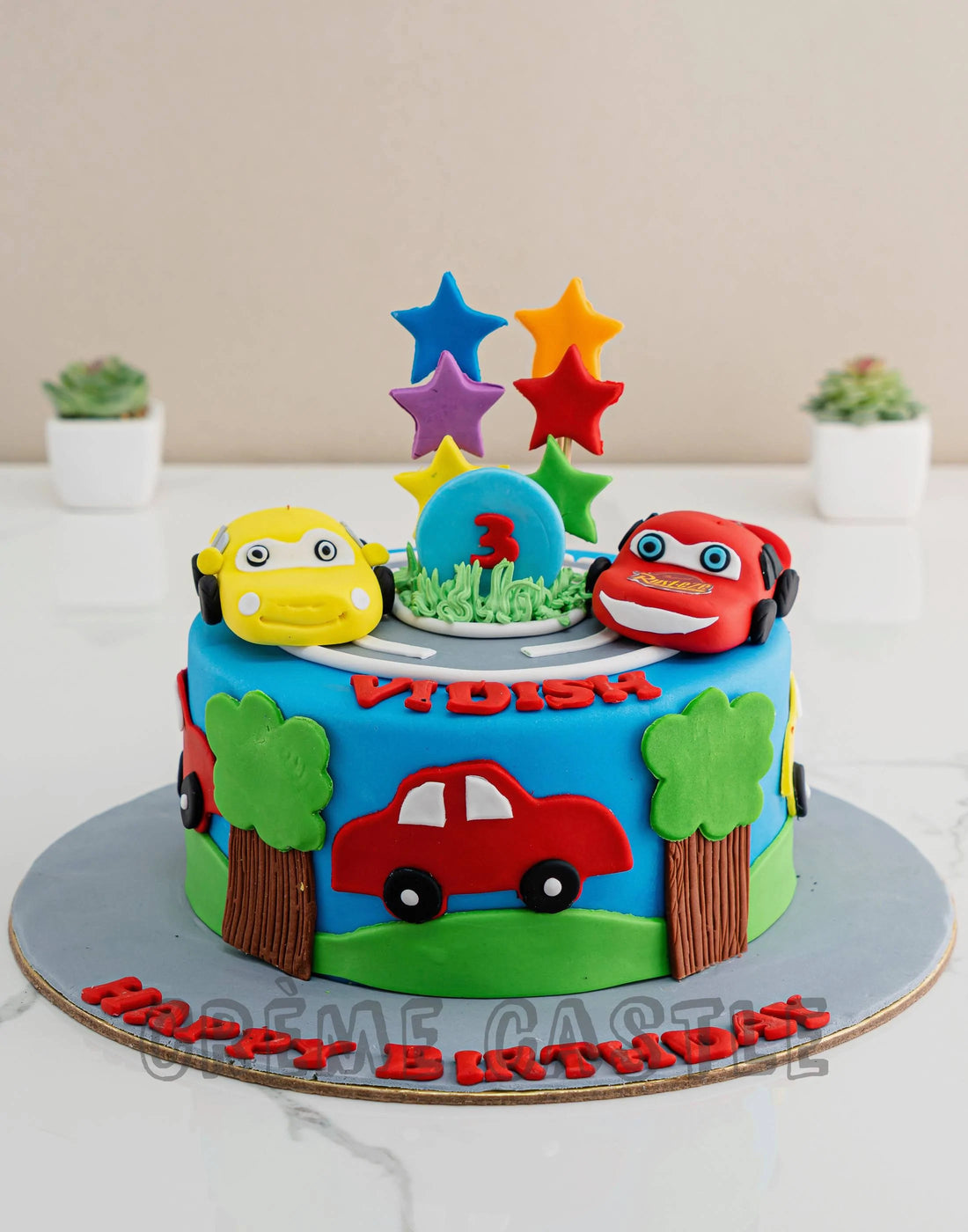 Cars Theme Cake in Blue color by Creme Castle