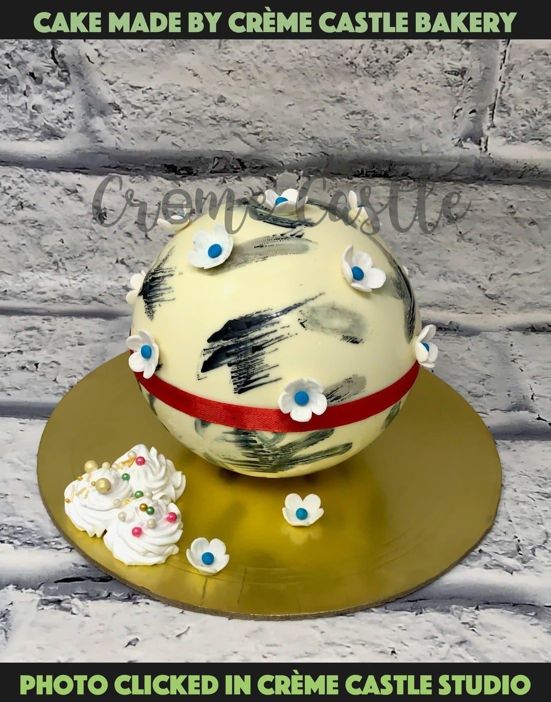 Chocolate Ball Pinata Cake - Creme Castle