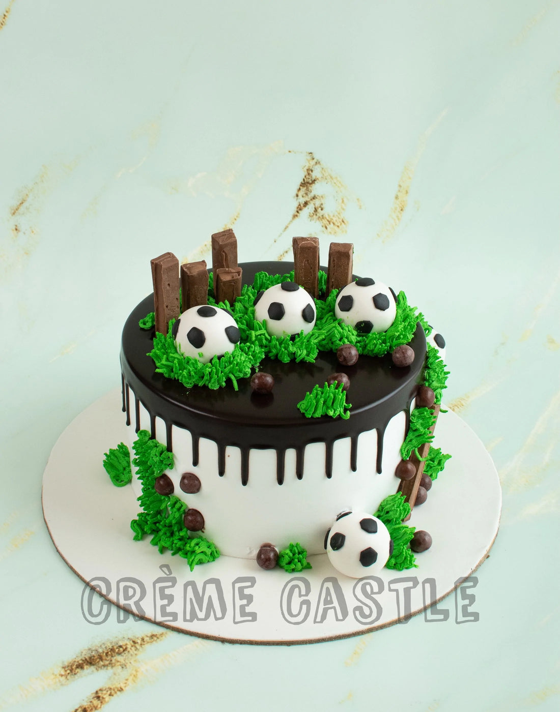 Football Theme Cake in Drip by Creme Castle