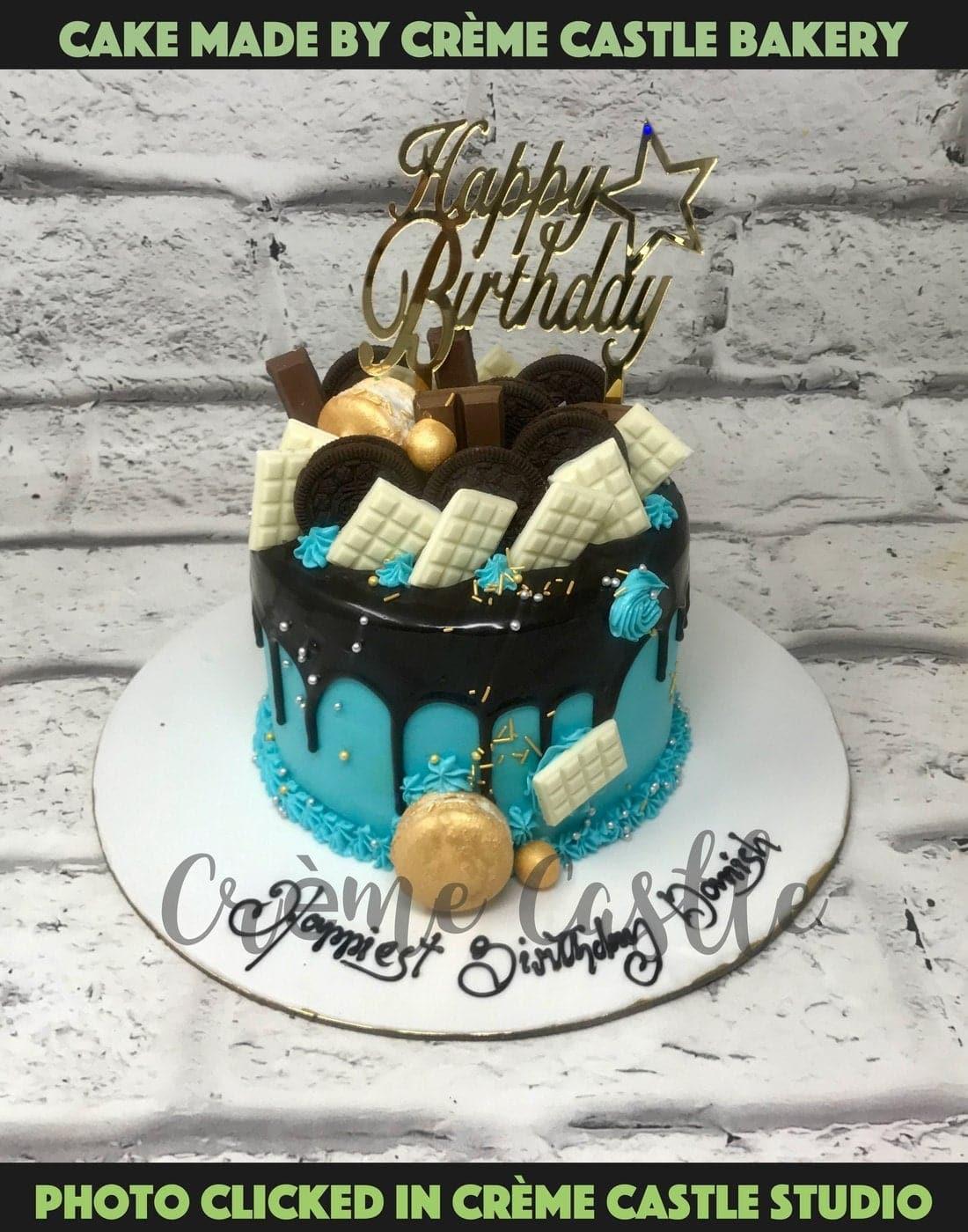 Gold drip cake with sprinkles and mini choco bars - FunCakes