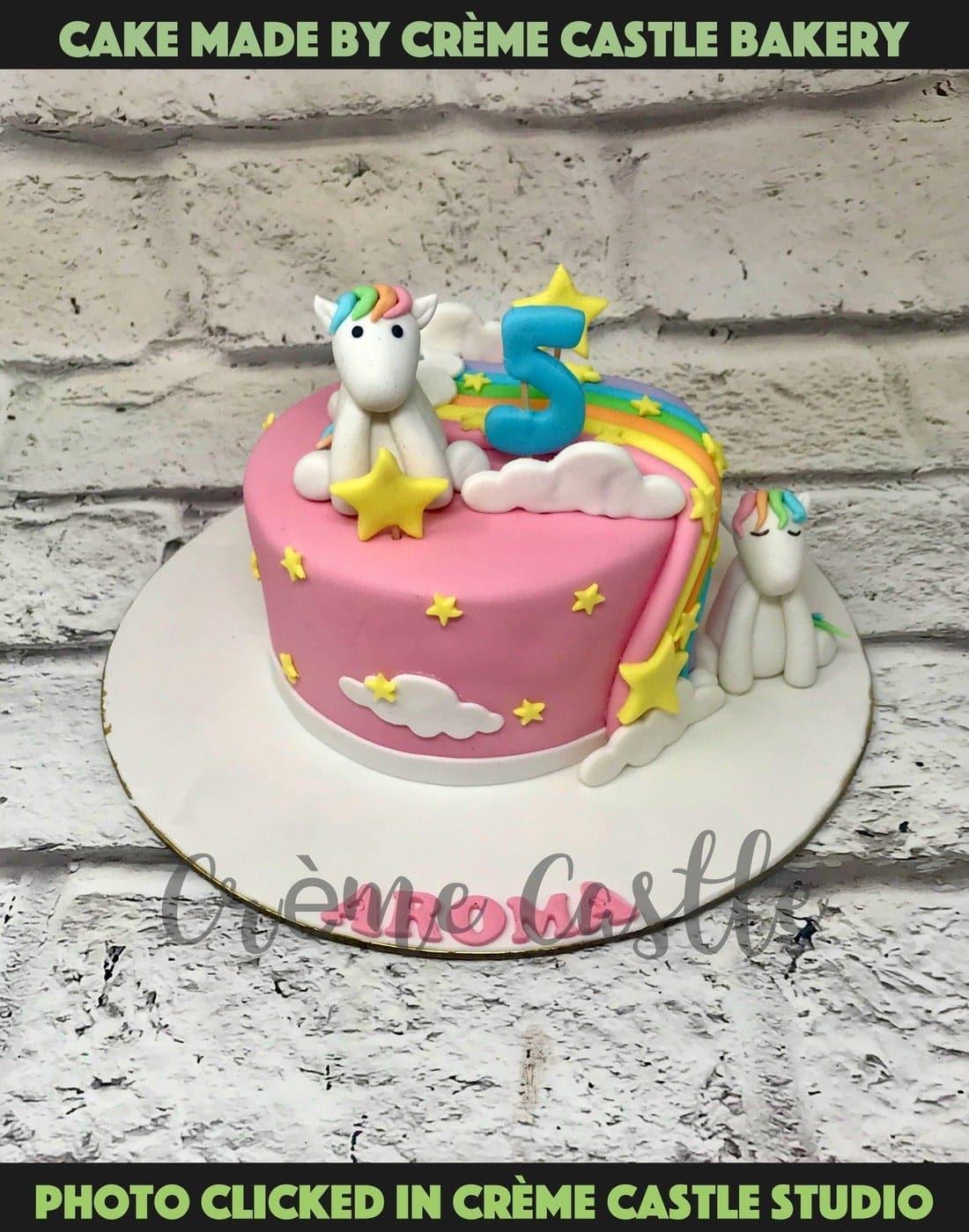 Unicorns in rainbow Design Cake - Creme Castle