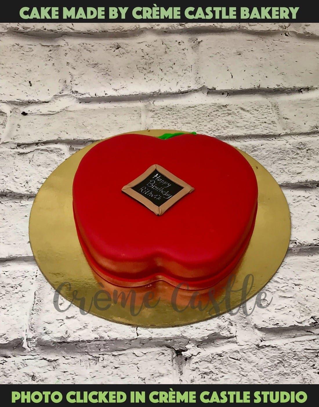 A white cake with Apple logo and iPhone on top for someone who is a big fan  of Apple – Creme Castle