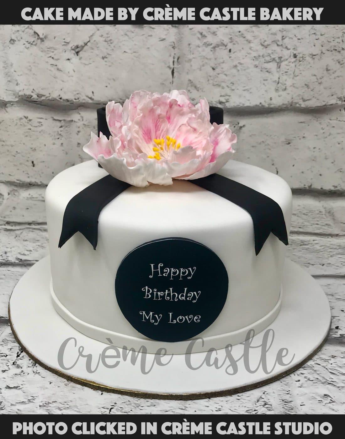 Bow and a flower Cake - Creme Castle