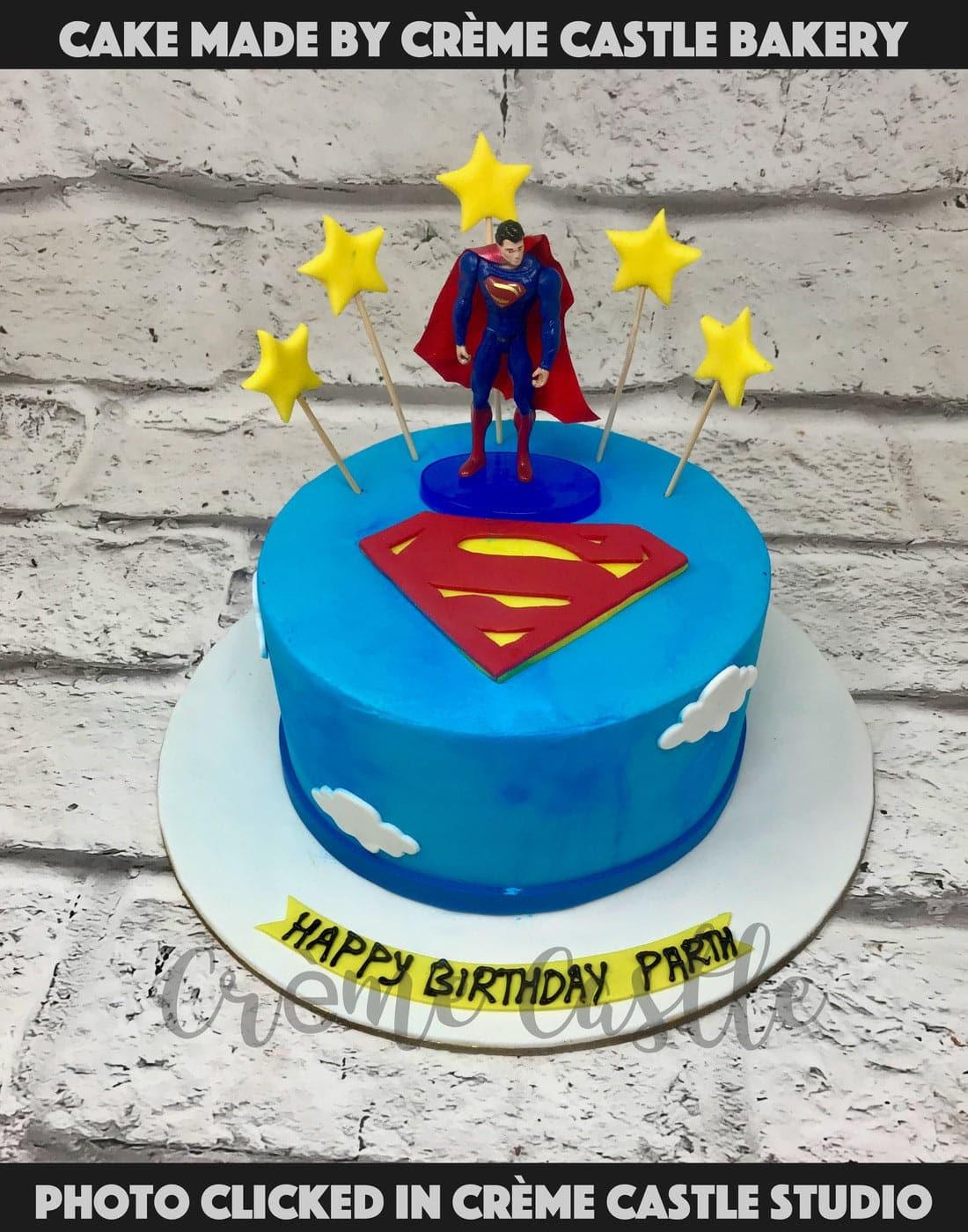 Superman with stars Cake - Creme Castle