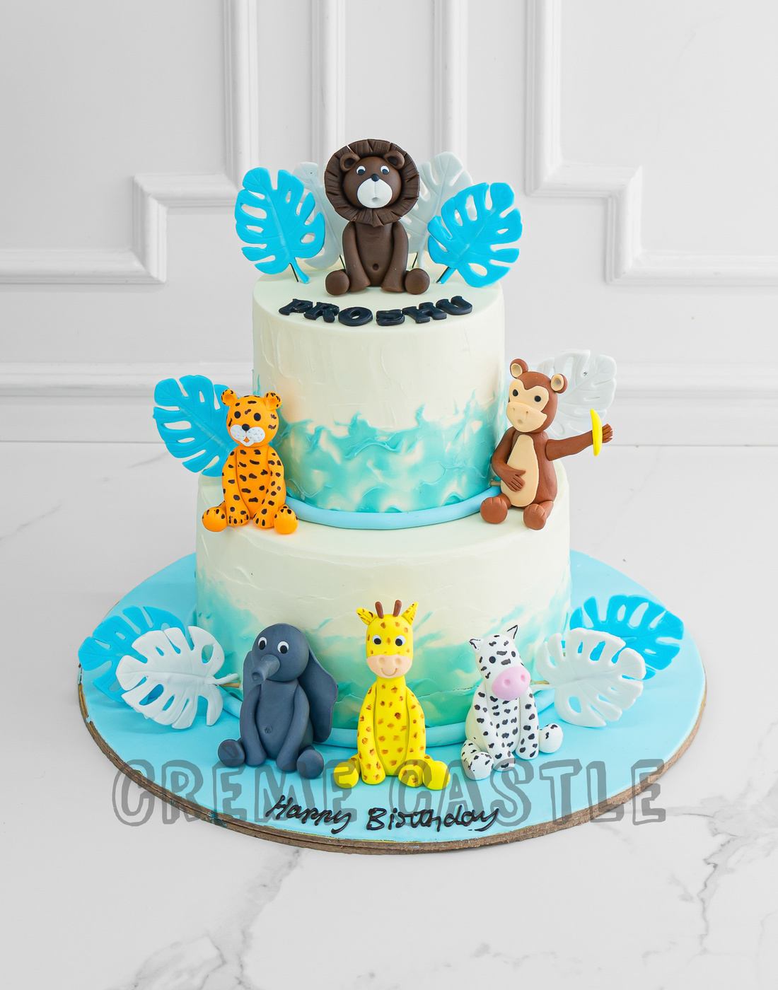 Pastel Blue Jungle Cake - Creme Castle