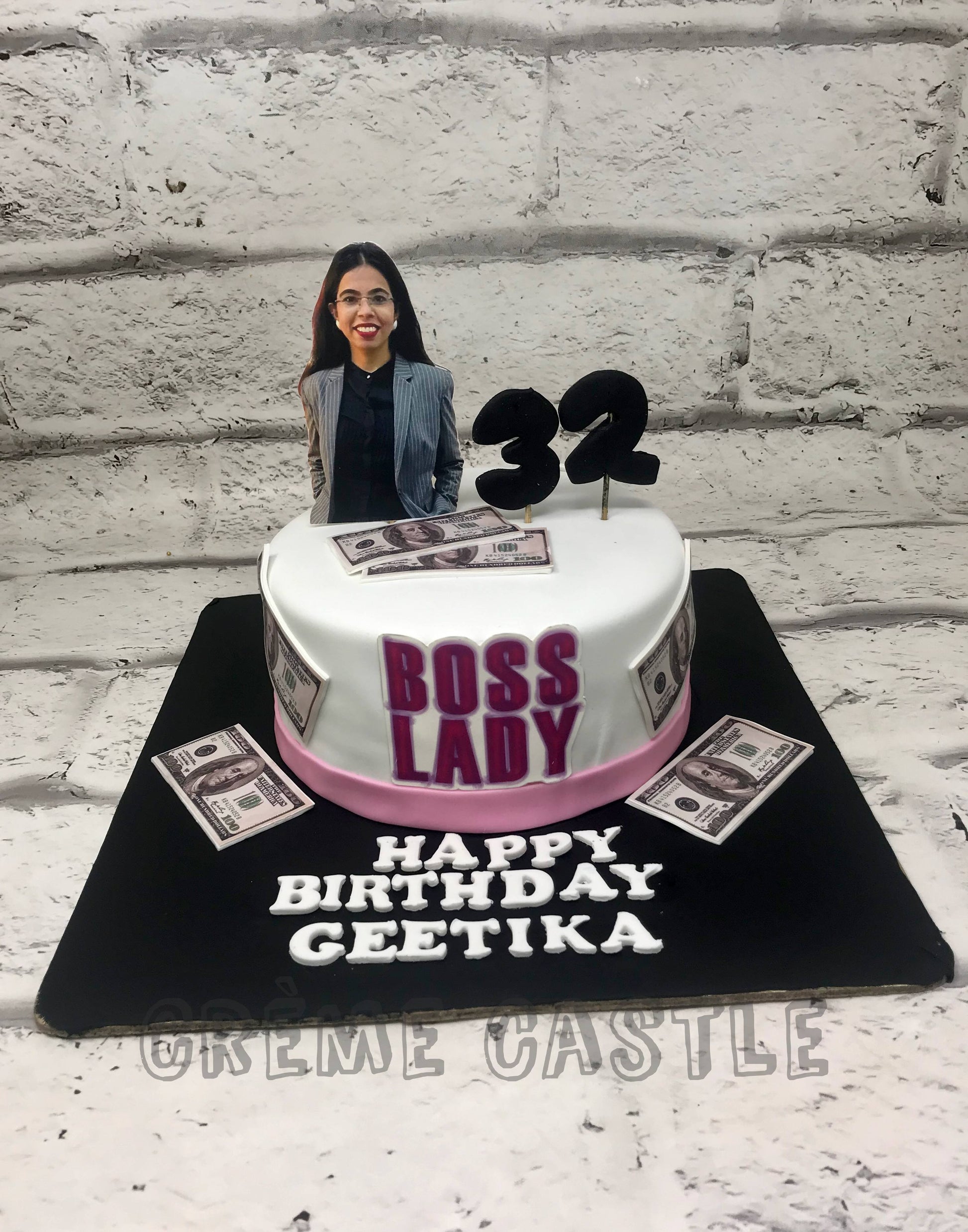 Boss Theme cake for a woman by Creme Castle