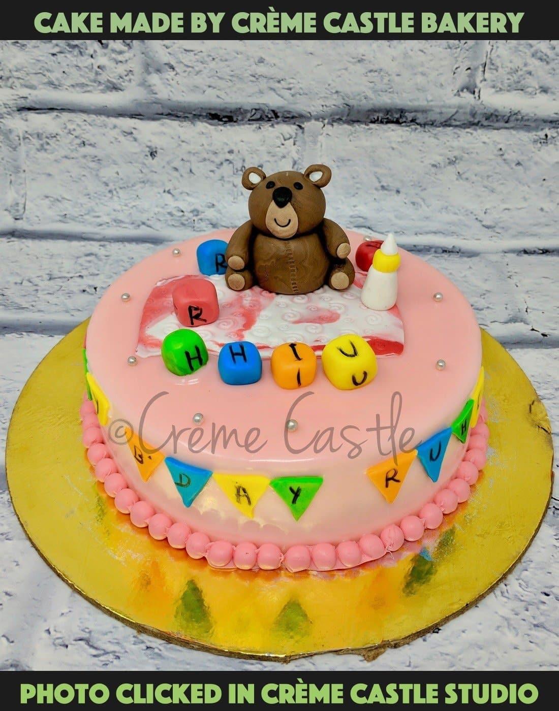 Baby bear with toys - Creme Castle