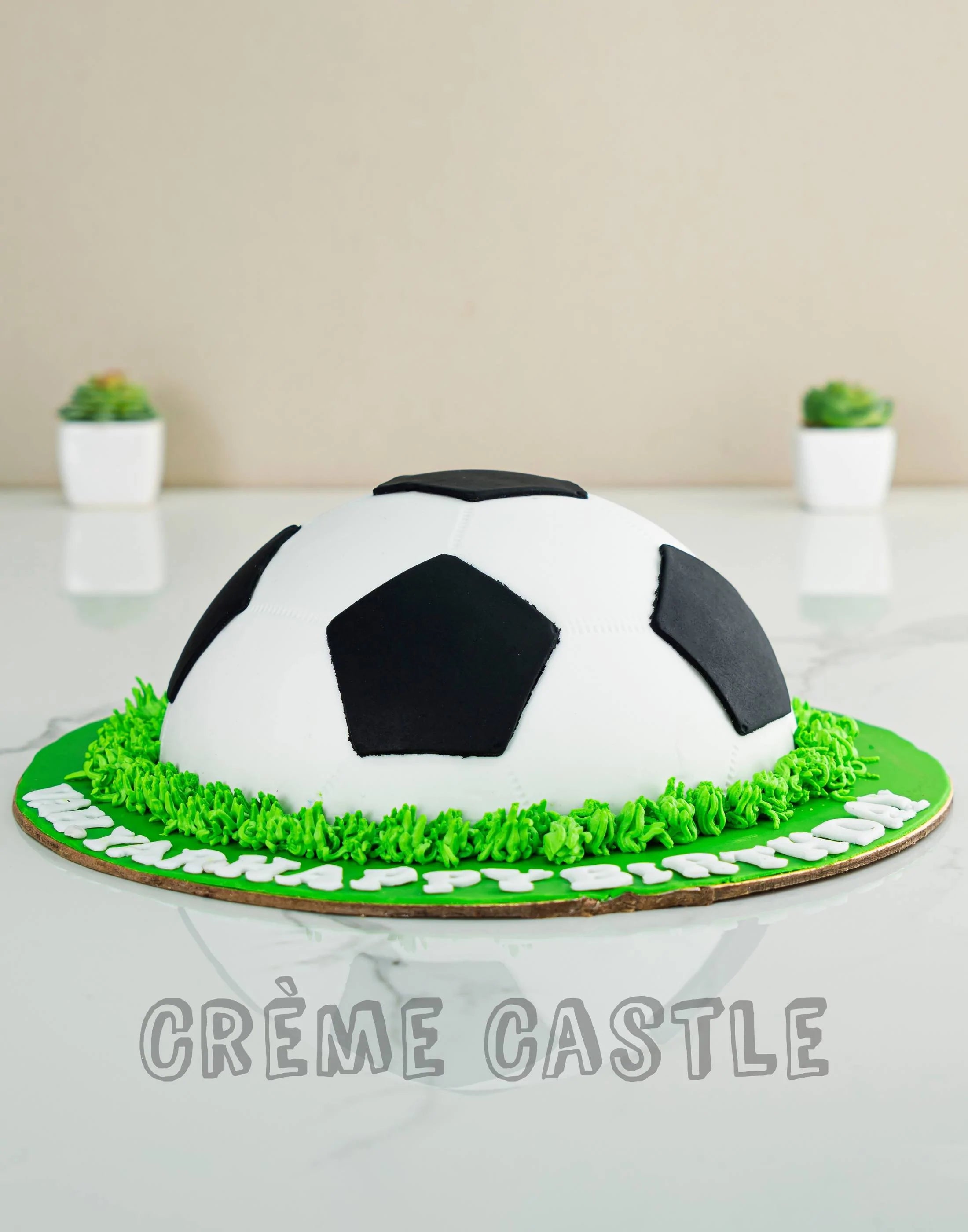 Closeup Image Of Football Themed Layered Birthday Cake Decorated On Cake  Board With Black And White Hexagonal Shaped Fondant Icing Tessellating  Tiles With Red Background Soccer Balls And Blades Of Green Grass